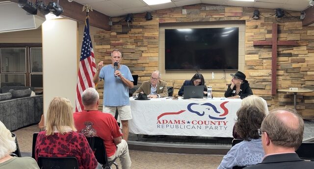 A candidate speaking to the room