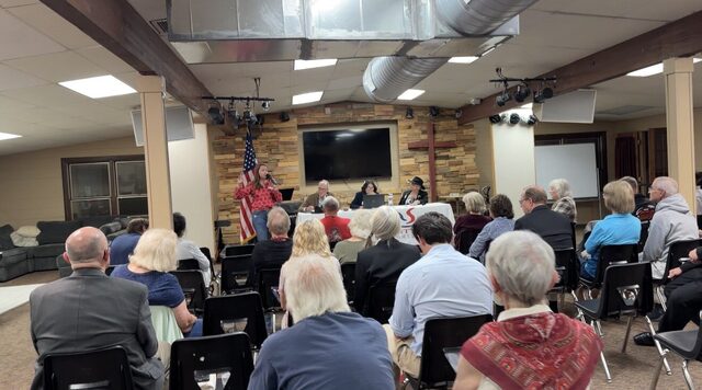 The audience listening during the meeting