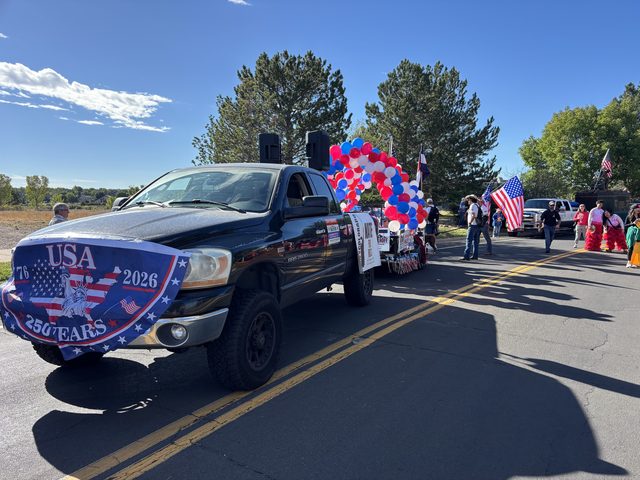 The lead truck with its USA 250 banner lining up for the parade