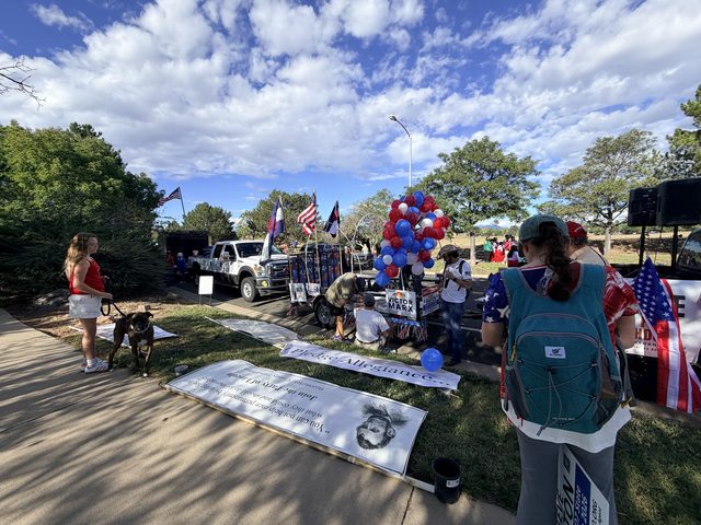Banners laid out on the grass while volunteers get ready