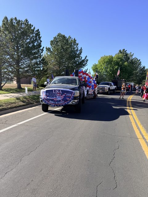 The parade truck rolling down the road