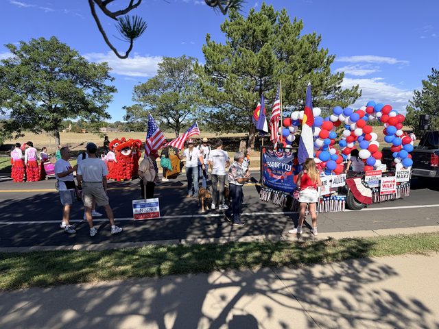 Marchers gathering beside the float