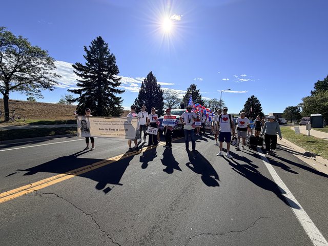 The group behind the banner on the route